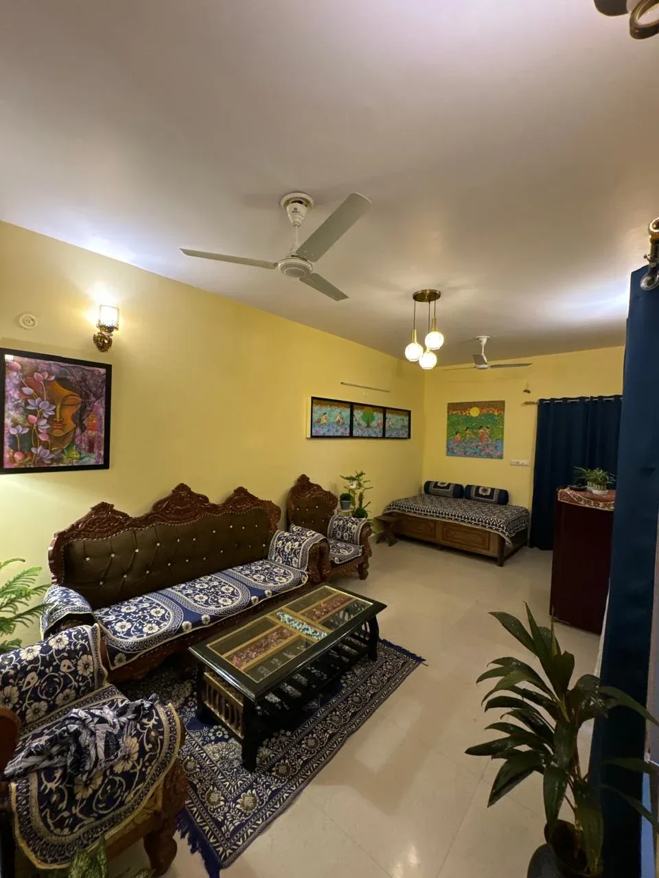 Living room wall with a large framed floral face painting